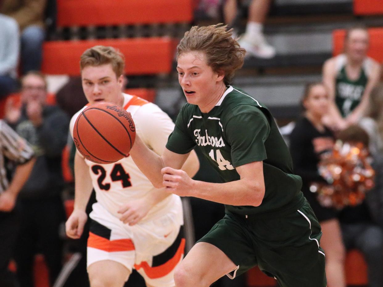 St. Mary Catholic Central's Michael Laboe pushes the ball up the court during a game last season.