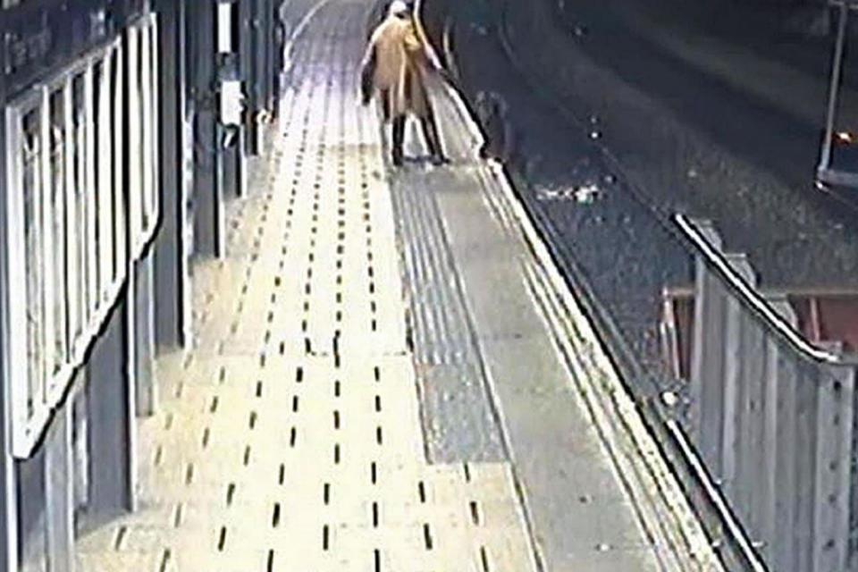 A Good Samaritan rescues a man who had fallen onto the railway line. (PA)