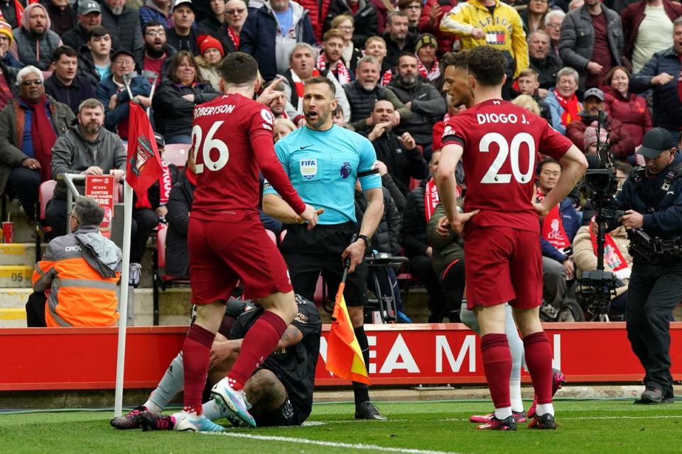 Liverpool’s Andy Robertson (left) confronts linesman Constantine Hatzidakis during the game (Nick Potts/PA) (PA Wire)