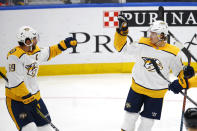 Nashville Predators' Mikael Granlund, right, of Finland, celebrates with Roman Josi, of Switzerland, after scoring the game winning goal against the St. Louis Blues during the third period of an NHL hockey game Saturday, Feb. 15, 2020, in St. Louis. (AP Photo/Billy Hurst)