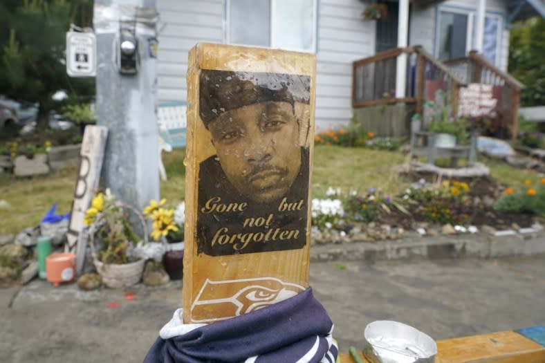 A sign is displayed on May 27, 2021, at a memorial in Tacoma, Wash., where Manuel “Manny” Ellis died March 3, 2020, after he was restrained by police officers. (AP Photo/Ted S. Warren, File)