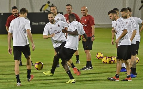 Gonzalo Higuain (third left) training with AC Milan - Credit: afp