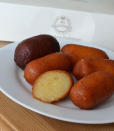 <b>Gulab Jamun (India)</b> <br> These morsels are enjoyed in India and are served at special occasions, particularly weddings. Milky dough is rolled into balls and then quickly deep-fried. They are then soaked in sugar syrup for a few hours or overnight, making them moist and sticky as well as sweet. Gulab Jamun can be flavoured with cardamom or saffron and they’re best eaten warm. Check out Asian stores near you, where you can get boxes of them ready to cook at home.