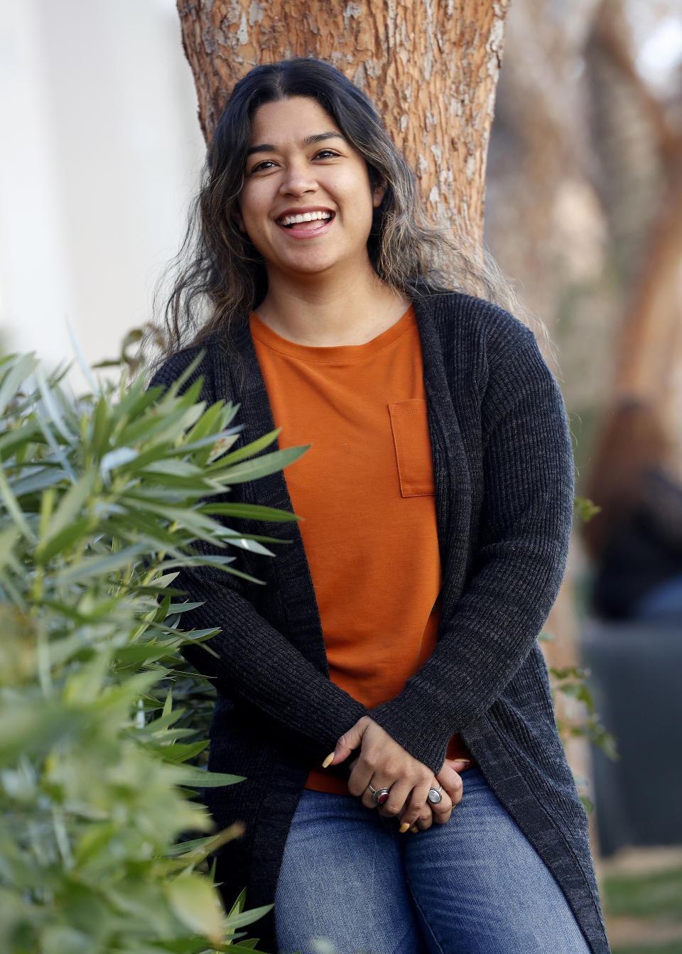 Maxima Guerrero poses for a photo in Phoenix on Wednesday, Jan. 23, 2019. Immigrants who were brought to the U.S. as children see little reason to be hopeful about the latest proposal to extend protections to them as part of President Donald Trump's plan to reopen the federal government. Guerrero, a Phoenix activist who has had Deferred Action for Childhood Arrivals program (DACA) protections since 2013, the court challenges, the politics and the perpetual debate involving the program has taken an emotional toll. (AP Photo/Matt York)