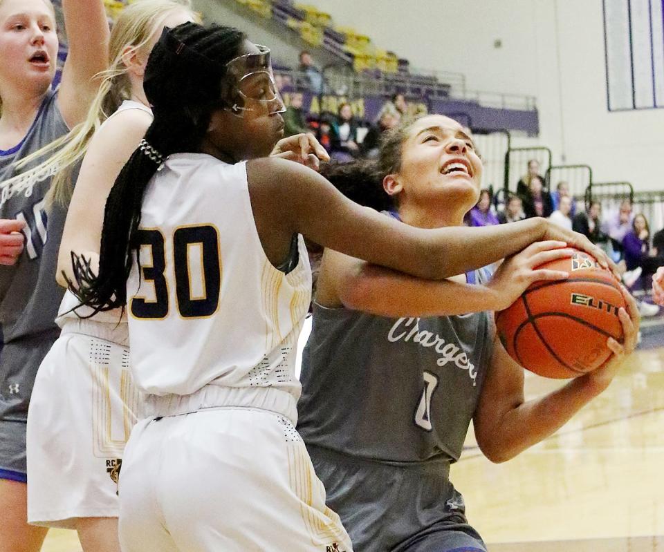 Sioux Falls Christian's Moriah Harrison  (0) looks to score against Rapid City Christian's Lydia Williams during their consolation semifinal game in the state Class A high school girls basketball tournament on Friday, March 10, 2023 in the Watertown Civic Arena.