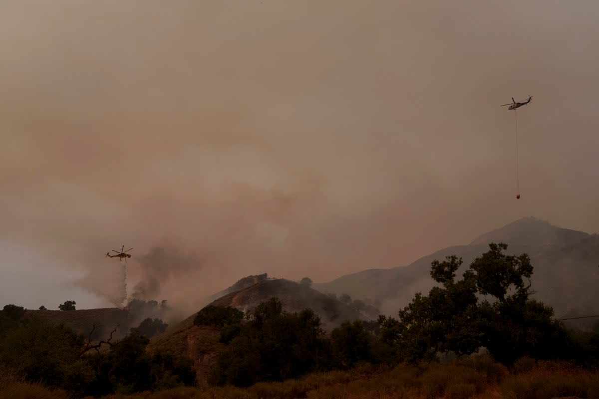 Helicopters drop water onto Lake Fire, devastating Santa Barbara County. Officials say just 8 percent of the fire is contained (Copyright 2024 The Associated Press. All rights reserved)