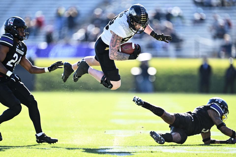 Nov 18, 2023; Evanston, Illinois, USA; Purdue Boilermakers tight end Garrett Miller (88) is tripped up by Northwestern Wildcats defensive back Jaheem Joseph (3) after a pass reception in the second quarter at Ryan Field. Mandatory Credit: Jamie Sabau-USA TODAY Sports