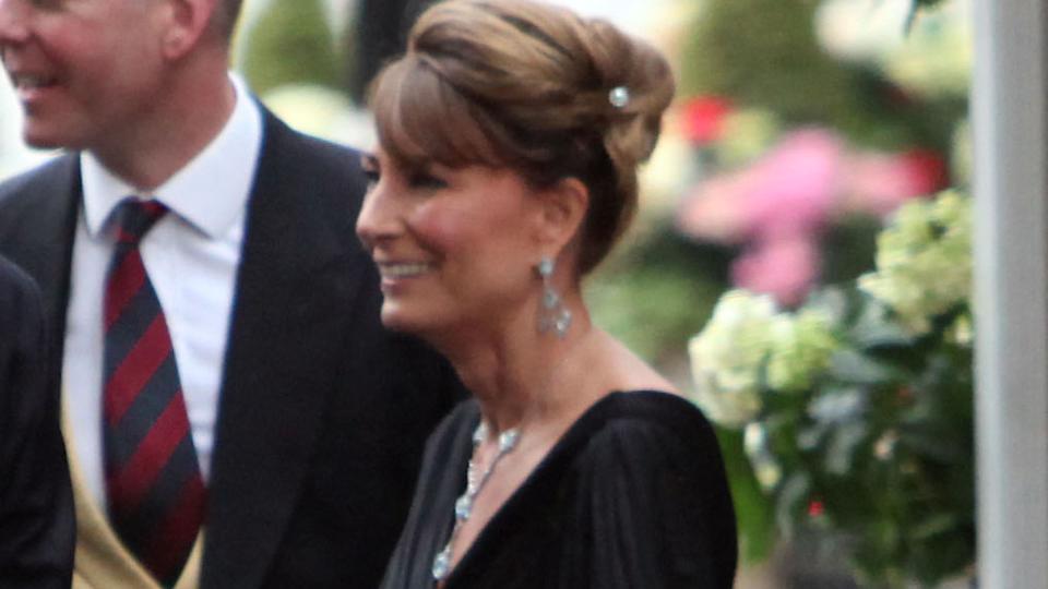 Carole Middleton in a black tiered gown with her hair up