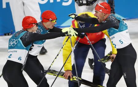 Nordic Combined Events - Pyeongchang 2018 Winter Olympics - Men's Individual 10 km Final - Alpensia Cross-Country Skiing Centre - Pyeongchang, South Korea - February 20, 2018 - Gold medalist, Johannes Rydzek of Germany, silver medalist, Fabian Riessle of Germany and bronze medalist Eric Frenzel of Germany celebrate. REUTERS/Dominic Ebenbichler