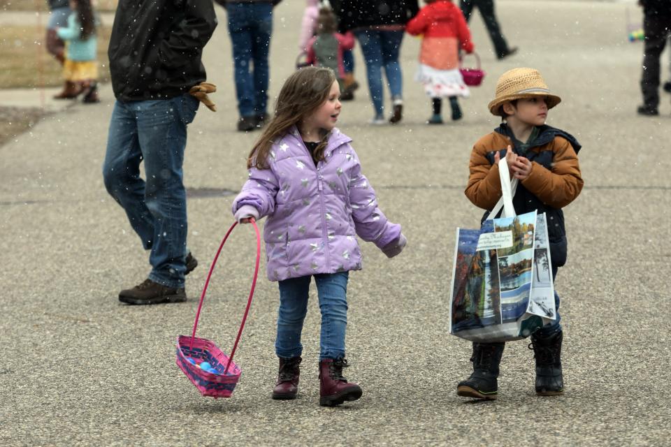 Kids look around for eggs during the Egg Scramble on Saturday, April 8, at the Emmet County Fairgrounds in Petoskey.
