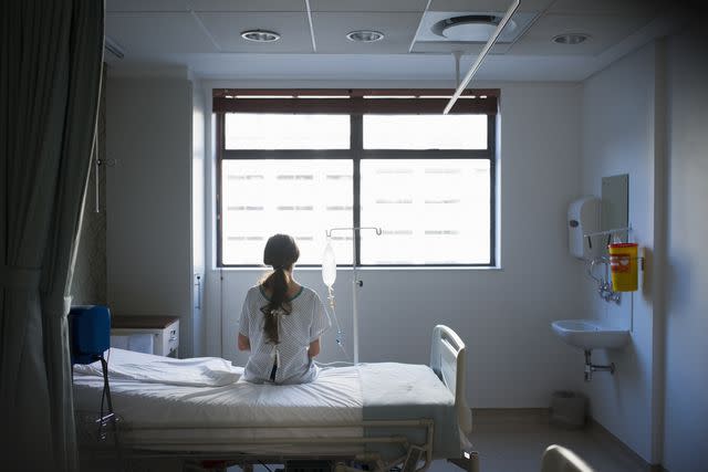 <p><br/></p><p>Portra Images</p> Stock image of patient sitting on hospital bed waiting.