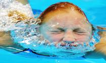 Ruta Meilutyte of Lithuania emerges water after competing in the women's 100m Breaststroke Heats during the Swimming competition held at the Aquatics Center during the London 2012 Olympic Games in London, England, 29 July 2012. EPA/HANNIBAL