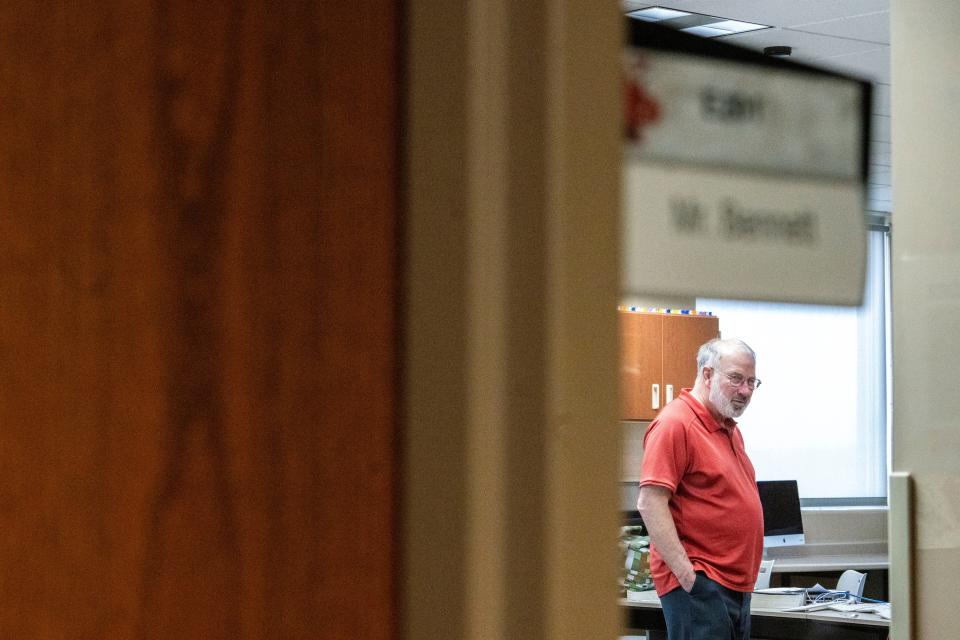 North Polk High School teacher Bruce Bennett stands inside his classroom during his last class of the day.