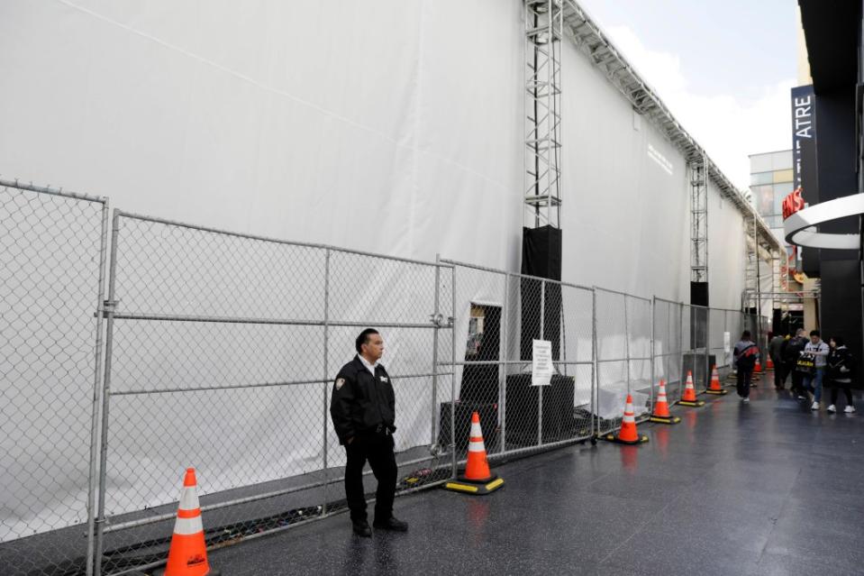 An Academy of Motion Picture Arts and Sciences private security officer stands guard outside the Dolby Theatre. Ruaridh Connellan for NY Post