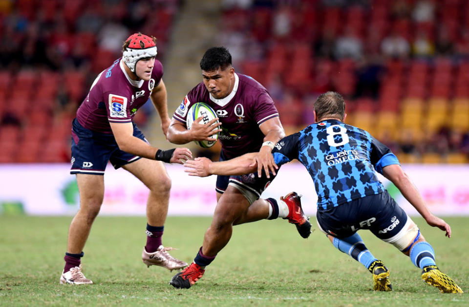 Alex Mafi of the Reds takes on the defence during the round seven Super Rugby match between the Reds and the Bulls in Brisbane, Australia.