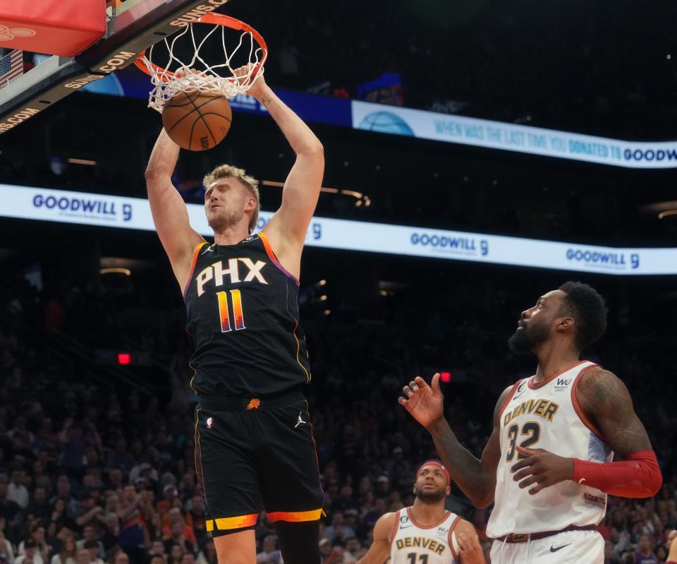 May 5, 2023; Phoenix, AZ, USA; Phoenix Suns center Jock Landale (11) dunks the ball over Denver Nuggets forward Jeff Green (32) during Game 3 of the Western Conference Semifinals at the Footprint Center. 