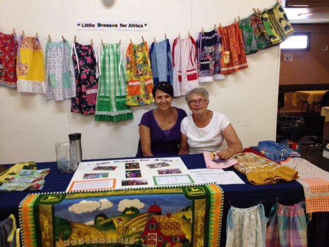 Suzanne Eisler, right, pictured with her daughter Kim Ursell, has been making dresses and shorts with her volunteer group in Wawota, Sask., for 10 years. The clothing is sent to children in countries around the world.