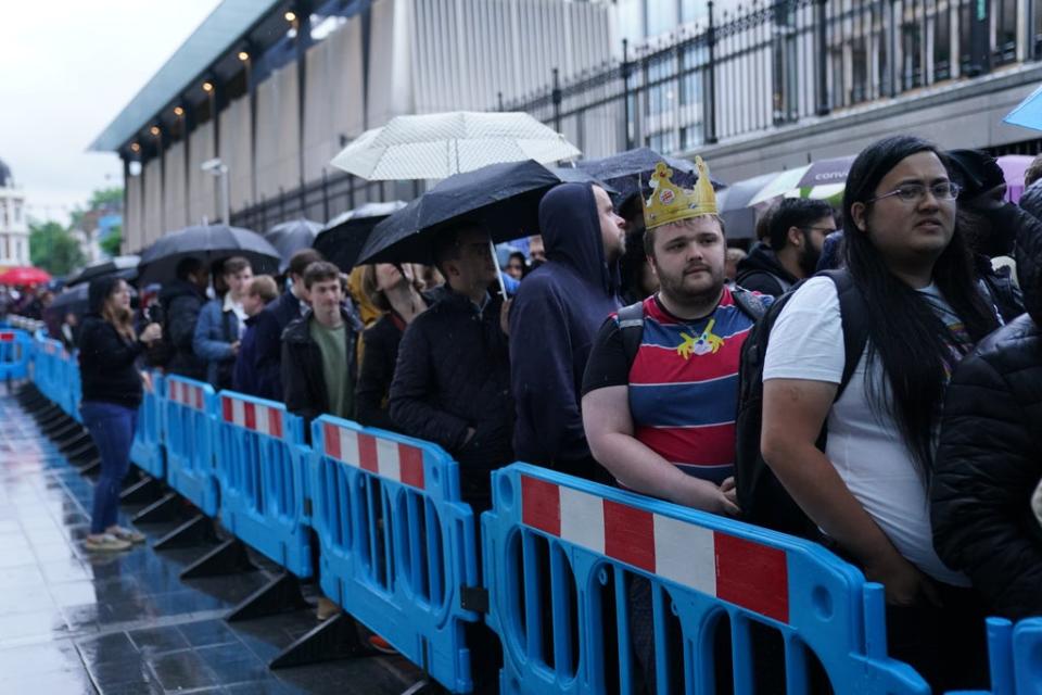 Crowds wait in line to board the first Elizabeth line train to carry passengers at Paddington Station, London (Kirsty O’Connor/PA) (PA Wire)