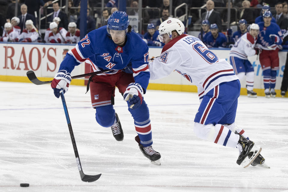 New York Rangers center Filip Chytil (72) is checked by Montreal Canadiens defenseman Otto Leskinen (64) during the second period of an NHL hockey game, Friday, Dec. 6, 2019, at Madison Square Garden in New York. (AP Photo/Mary Altaffer)