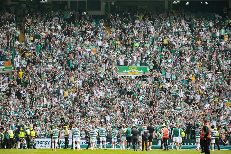 Celtic fans celebrate with their heroes