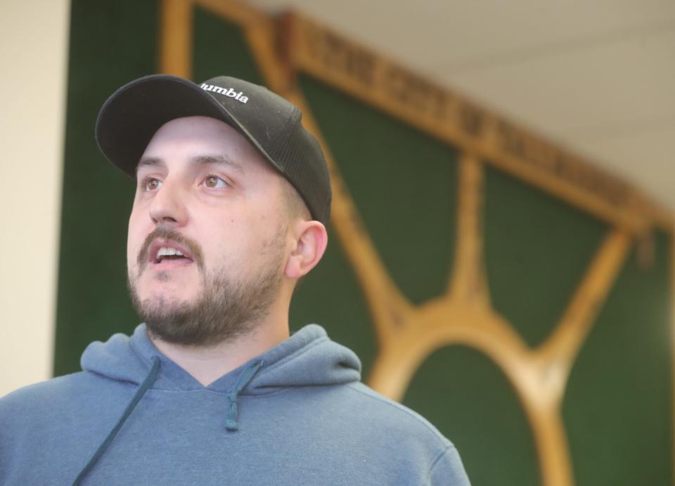 Tyler Hardman talks about how he vote on Issues 1 and 2 at the Tallmadge Community Center on Tuesday, Nov. 7, 2023, in Tallmadge, Ohio. [Phil Masturzo/ Beacon Journal]