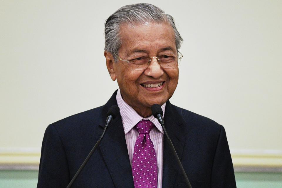 Malaysia's interim Prime Minister Mahathir Mohamad smiles during a press conference after unveiling an economic stimulus plan aimed at combating the impact of the COVID-19 novel coronavirus at the Prime Minister's Office in Putrajaya on February 27, 2020. (Photo by Mohd RASFAN / AFP) (Photo by MOHD RASFAN/AFP via Getty Images)