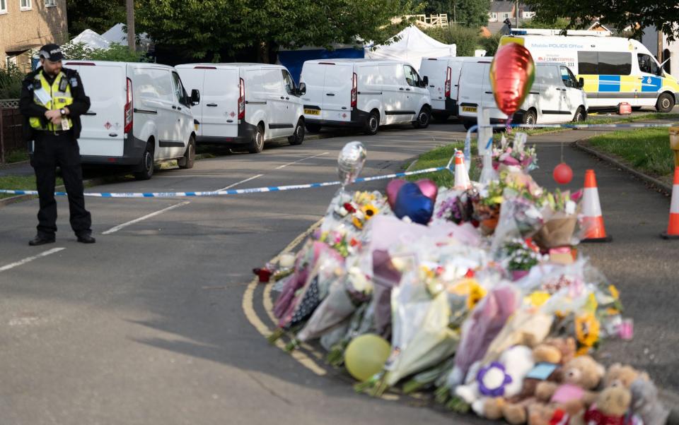 Flowers were laid outside the home in Killamarsh, Sheffield - Tom Maddick/SWNS