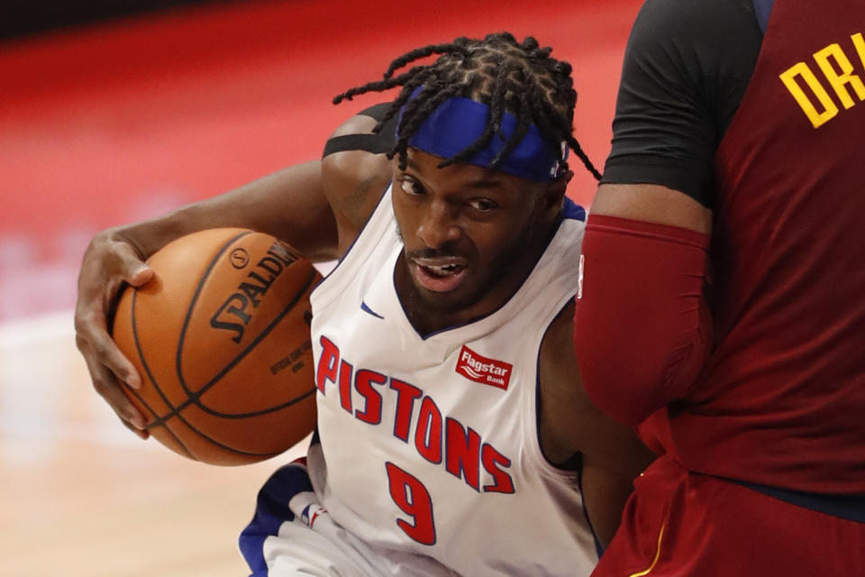 Dec 26, 2020; Detroit, Michigan, USA; Detroit Pistons forward Jerami Grant (9) gets called for a charging foul against Cleveland Cavaliers center Andre Drummond (3) during the second quarter at Little Caesars Arena. Mandatory Credit: Raj Mehta-USA TODAY Sports