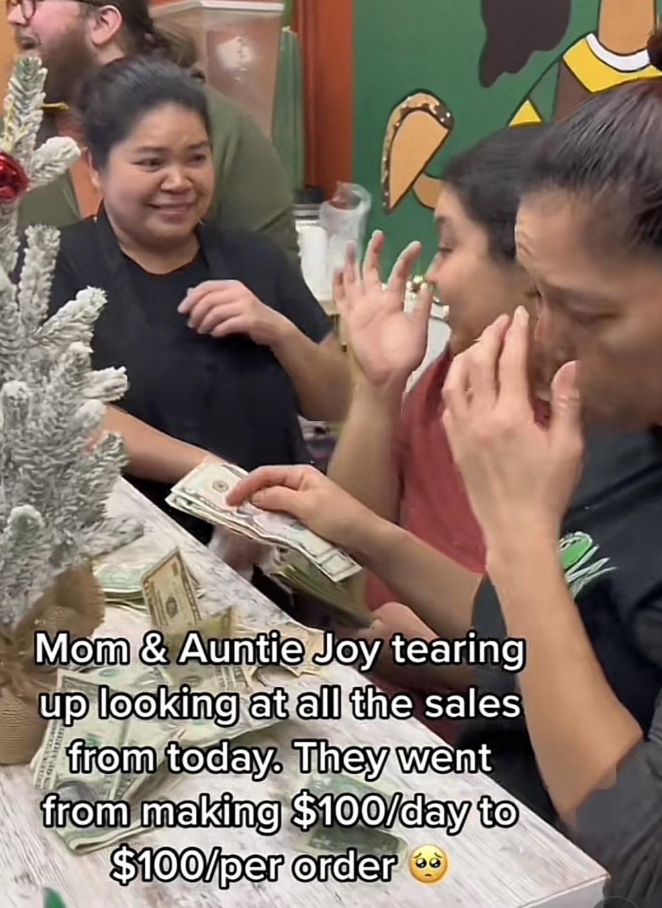 isabel, her mom, and aunt crying while counting cash for the day and caption: "mom and auntie tearing up looking at all the sales from today. they went from making $100/day to $100/order"