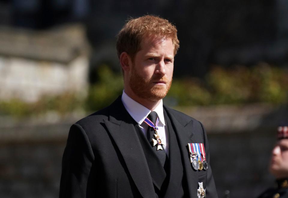 Prince Harry walks in the processionAP