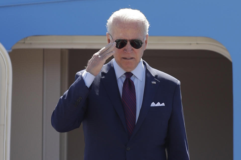 President Joe Biden salutes from the stairs of Air Force One at Andrews Air Force Base, Md., Tuesday, June 29, 2021. (AP Photo/Luis M. Alvarez)