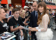 Jessica Biel signing her autograph for a fan.