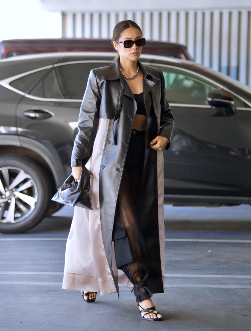 Shay Mitchell was spotted out in Beverly Hills on Tuesday as she headed to a meeting. The actress and model looked stylish in a Black crop top, cargo pants and a leather accented trench coat as she grabbed a few things from her car alongside an assistant. 25 May 2021 Pictured: Shay Mitchell. Photo credit: MEGA TheMegaAgency.com +1 888 505 6342 (Mega Agency TagID: MEGA757529_002.jpg) [Photo via Mega Agency]