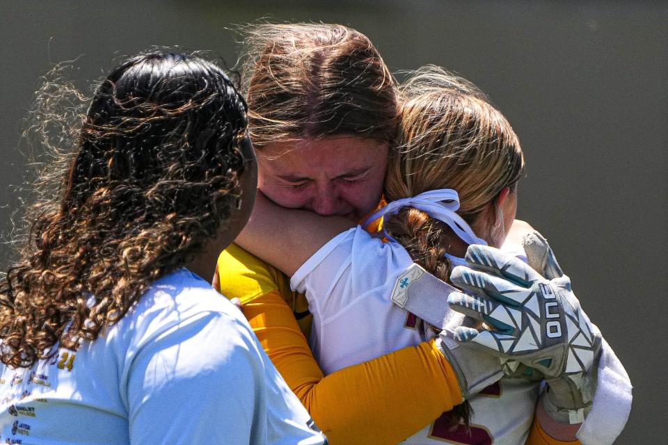 Rouse defender Mia Merz, center, hugs goalkeeper Kayla Hehenberger after the Raiders' Class 5A state semifinal loss to Frisco Wakeland 4-2 on penalty kicks. "We had some close ones (Thursday), but the girls left it all on the field," Rouse coach Corey Elrod said.