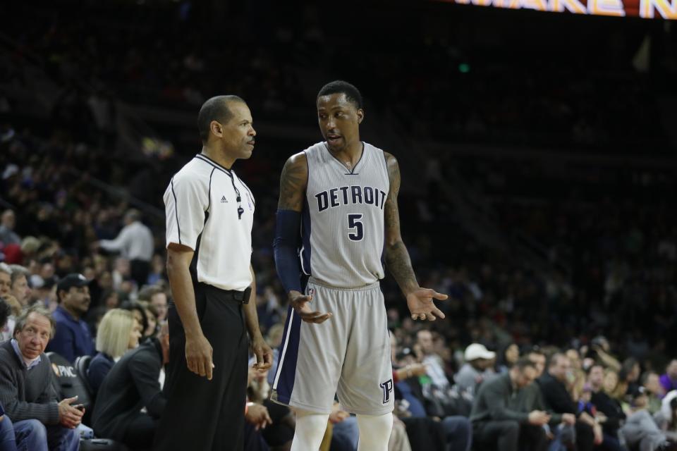 Detroit Pistons guard Kentavious Caldwell-Pope talks with NBA official Eric Lewis during a March 2017 game. (AP)