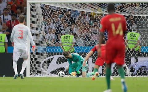 David De Gea makes an unthinkable handling error and Portugal 2-1 up - Credit: AP Photo/Sergei Grits