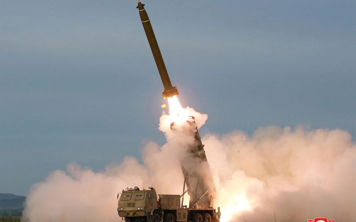 North Korean weapons such as this rocket launcher, pictured during a test launch in 2019 at an undisclosed location, could be on their way to Russia in a reported new deal - AFP