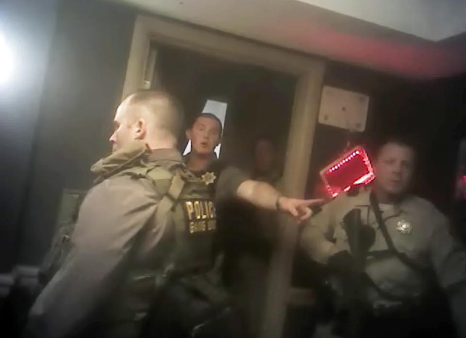 Officers can be seen giving orders moments before breaching Paddock’s room on the 32nd floor. Source: Las Vegas Metropolitan Police Department via AP