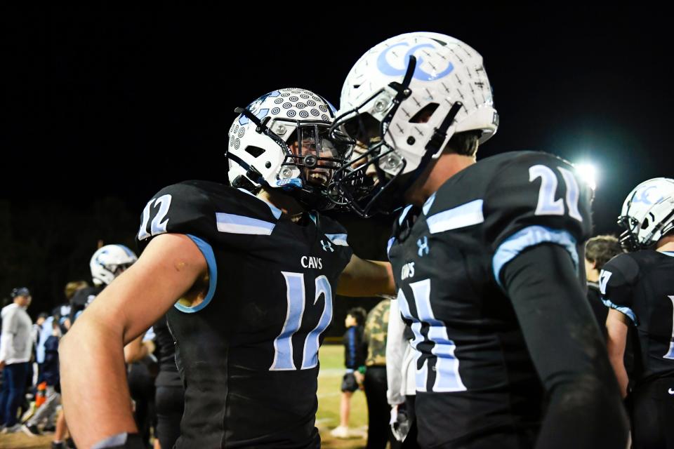 St. Joseph's Trey Sanders (12) celebrates the 21-7 win with St. Joseph's Nicholas Montangano (21) during the game against St. Joseph on Friday, Nov. 25, 2022. 