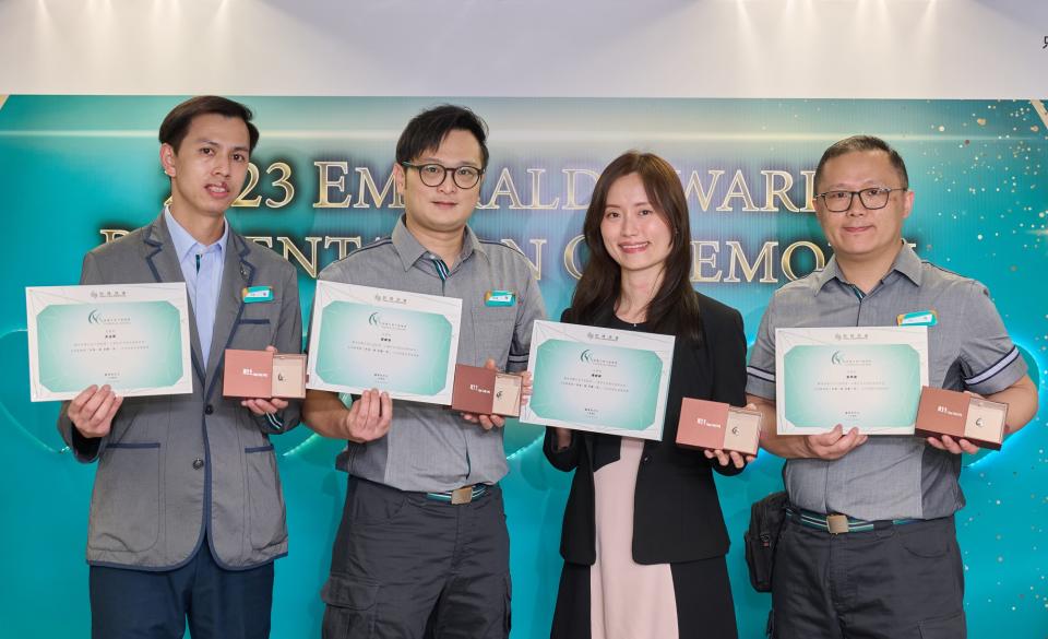 (From left) Ng Kam Fai, Ngan Chun Hung, Joey Chan and Lau Hok Lai from Amoy Gardens, Hong Kong, receive the Hang Lung Emerald Award for demonstrating their sense of mission to protect residents&#39; health and safety. Their proactive follow-up successfully averted the potential danger of concrete falling on an elderly resident in her unit, despite the resident rejecting earlier offers of assistance