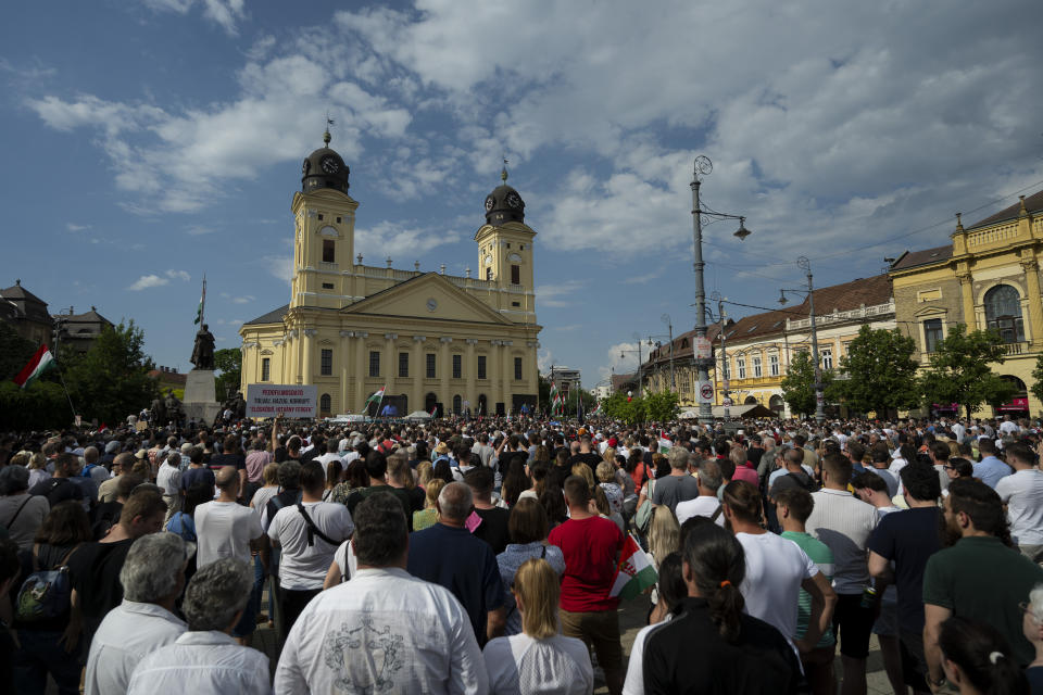 People listen to Péter Magyar's speech at a campaign rally in the rural city of Debrecen, Hungary, on Sunday, May 5, 2024. Magyar, whose TISZA party is running in European Union elections, has managed to mobilize large crowds of supporters on a campaign tour of Hungary's heartland, a rarity for an Orbán opponent. (AP Photo/Denes Erdos)