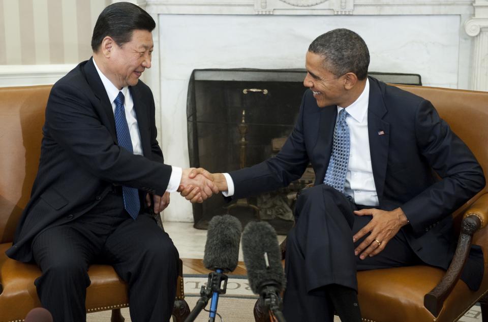 U.S. President Barack Obama shakes hands with then-Chinese Vice President Xi Jinping during meetings in the Oval Office of the White House in Washington, D.C., Feb. 14, 2012.