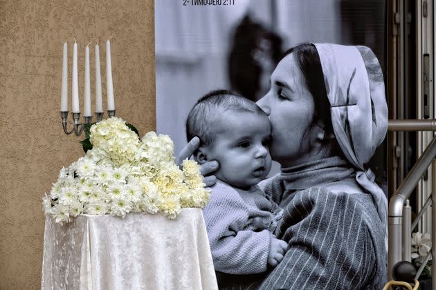 The photo of Anna Haidarzhy, 31, and her 4-month-old son, Tymofii, who died under the rubble of the collapsed section of the apartment block hit by the Russian drone in Odesa on March 2 is seen during the memorial service, in Odesa, southern Ukraine.