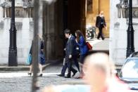 PM hopeful Rory Stewart walks inside the Parliament grounds in London