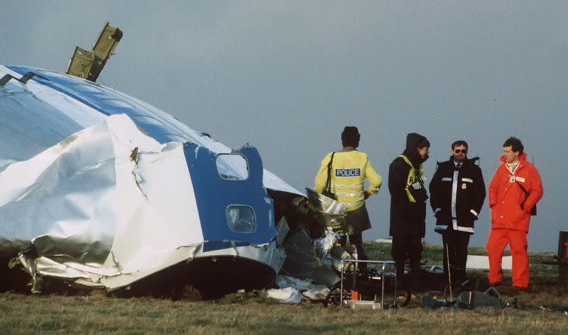 FILE PHOTO: Scottish crash investigators at the site of the Lockerbie Pan Am flight 103 bombing in 1988.