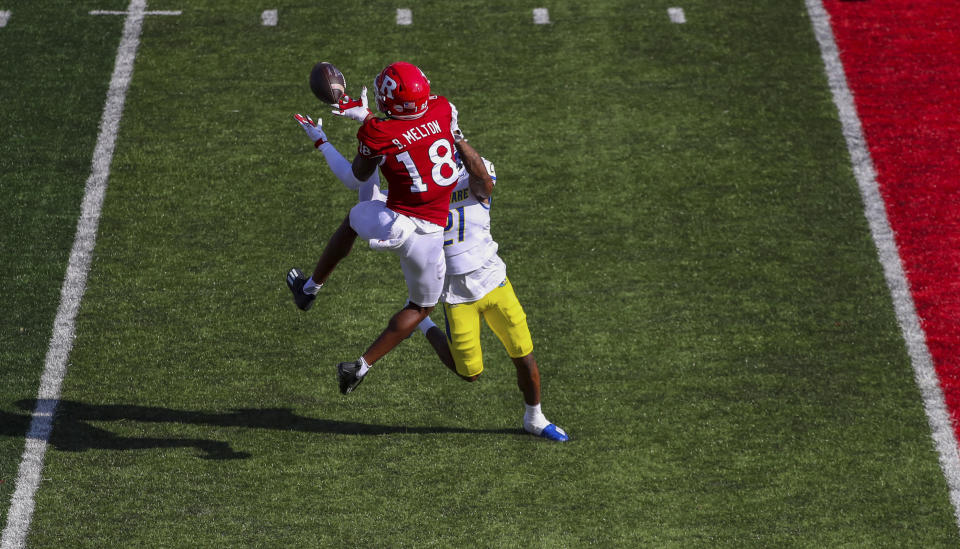 Rutgers wide receiver Bo Melton (18) beats Delaware defensive back Justis Henley (21) to catch a pass for a 28-yard touchdown during the first half of an NCAA college football game, Saturday, Sept. 18, 2021, in Piscataway, N.J. (Andrew Mills/NJ Advance Media via AP)