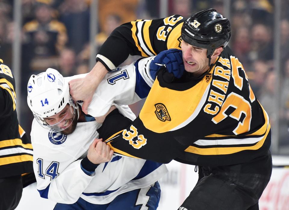 Tampa Bay Lightning forward Pat Maroon and Boston Bruins defenseman Zdeno Chara fight during a March game.