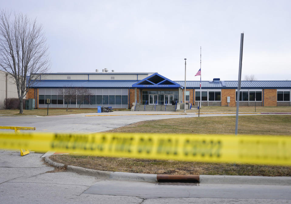 Tape blocks all entrances at the Perry Middle School and High School building on Friday, Jan. 5, 2024, in Perry, Iowa. A day after a shooting sent bullets flying inside the small-town Iowa high school, leaving a sixth grader dead and others wounded, the community of Perry is somber. (AP Photo/Bryon Houlgrave)