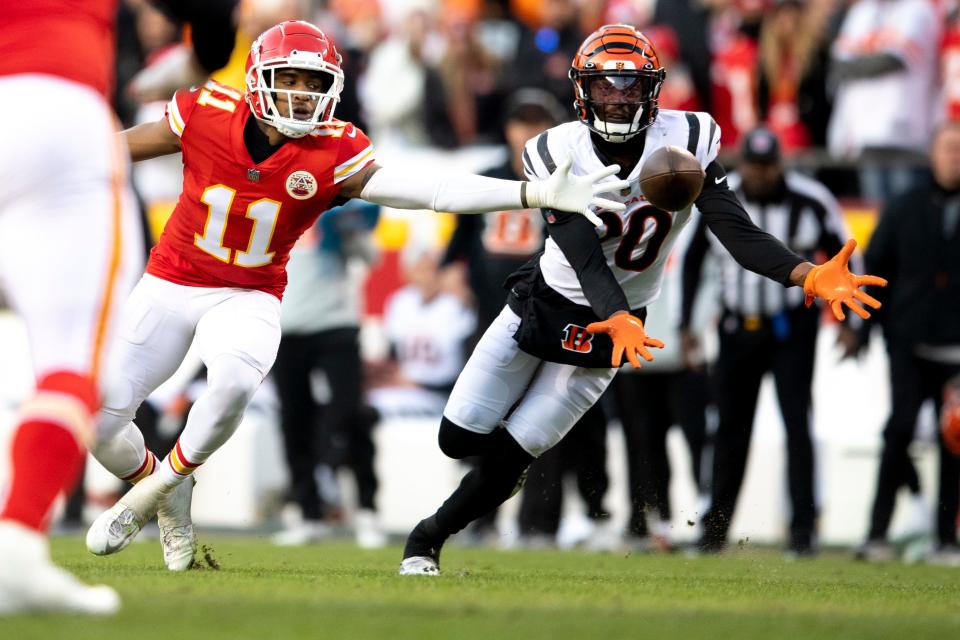 Cincinnati Bengals cornerback Eli Apple (20) breaks up a pass intended for Cincinnati Bengals wide receiver Trent Taylor (11) in overtime of the AFC championship NFL football game, Sunday, Jan. 30, 2022, at GEHA Field at Arrowhead Stadium in Kansas City, Mo. Cincinnati Bengals defeated Kansas City Chiefs 27-24.