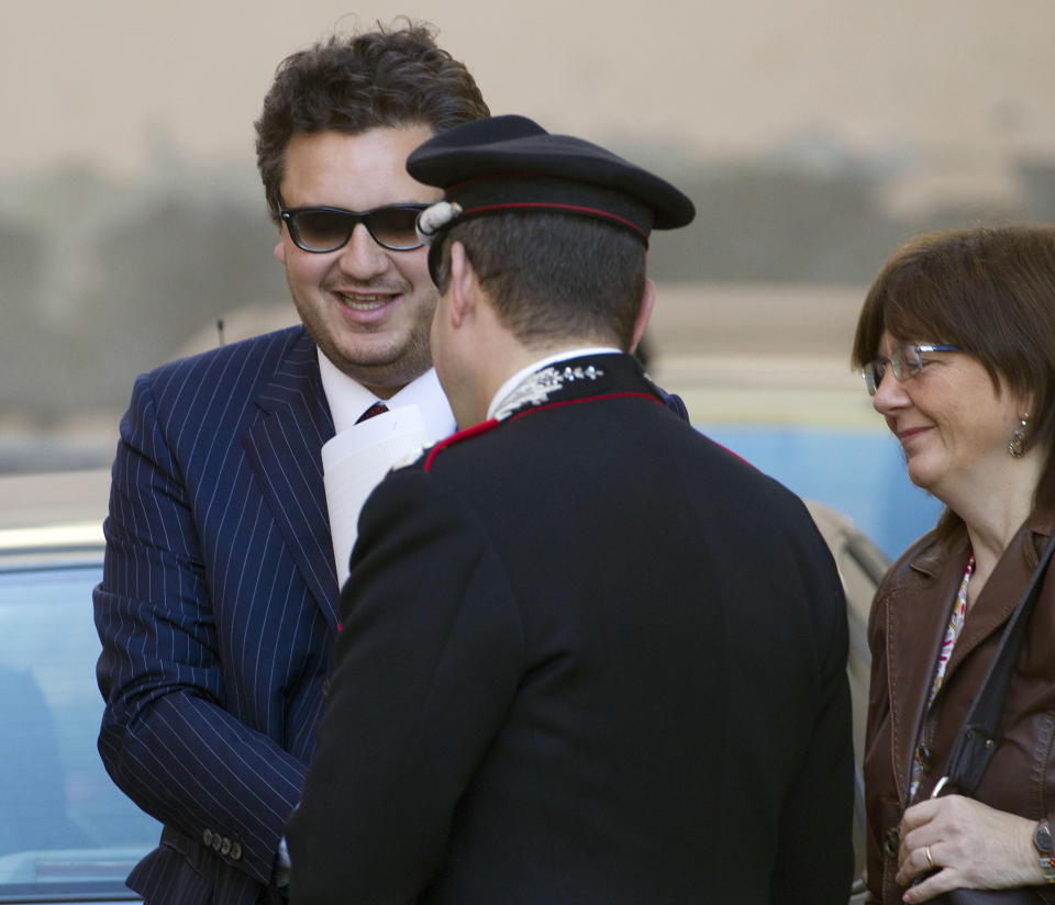 Prosecutors Stefano Pizza, left, and Maria Navarro, right, arrive for the preliminary, closed-door hearing for the 2012 grounding off Tuscany that killed 32 people, in Grosseto, Italy, Monday, April 15, 2013. An Italian court is mulling whether to hand down indictments against the captain and some crew of the Costa Concordia cruise ship for the 2012 grounding off Tuscany that killed 32 people. Prosecutors want Capt. Francesco Schettino to stand trial for alleged manslaughter, causing a shipwreck and abandoning the ship before all passengers had been evacuated. They want four other crew members and a Costa manager to face charges of having botched the emergency Schettino attended the preliminary, closed-door hearing Monday in the Tuscan city of Grosseto; the timing of a decision was unknown. (AP Photo/Andrew Medichini)